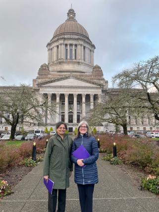 Munira Khalil and Dianne Harris stand in front of the Legislative Building in Olympia, WA