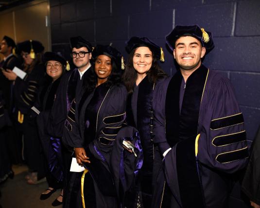 PhD graduates wait with anticipation for the commencement ceremony to begin