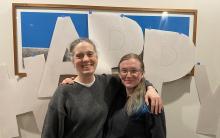 Prof. Sarah Keller and alum Aurelia Honerkamp Smith embrace as they smile at the camera.