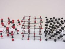 three ball-and-stick models of crystal lattices