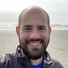David Masiello with ocean shoreline behind him. 