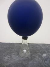 an inflated balloon attached to an erlenmeyer flask, 