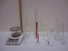metric scale instruments: a scale, graduated cylinders, flasks