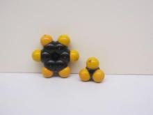 a yellow and black space-filling molecular model