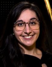 Headshot of Theresa Gozzo wearing glasses and smiling at the camera