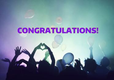 A group of people in silhouette with balloons