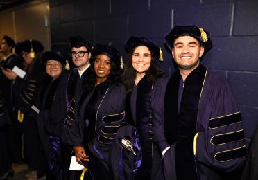 PhD graduates wait with anticipation for the commencement ceremony to begin