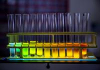 Stock photo of test tubes with fluorescent material in colors of blue, green, yellow, orange, and red