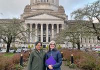 Munira Khalil and Dianne Harris stand in front of the Legislative Building in Olympia, WA