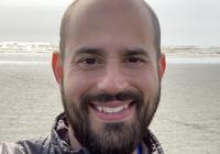 David Masiello with ocean shoreline behind him. 