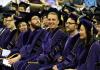 PhD graduates dressed in UW regalia sit in a row at the commencement celebration for the Departments of Chemistry and Biochemistry.
