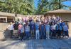 A group of more than 50 people pose for a photo