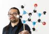Jeffrey Buenaflor holding a molecular model