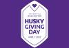 White hexagon on purple background with text "University of Washington Husky Giving Day, April 7, 2022"