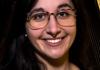 Headshot of Theresa Gozzo wearing glasses and smiling at the camera