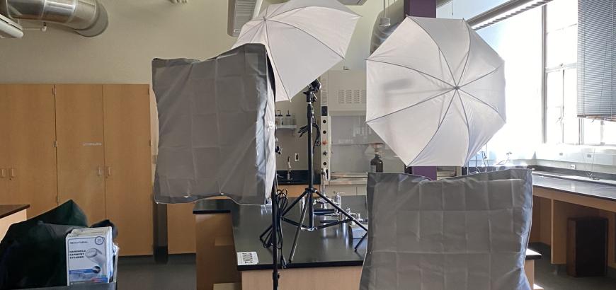 Lighting and backgrounds set up in an undergraduate teaching laboratory to shoot content for remote learning.